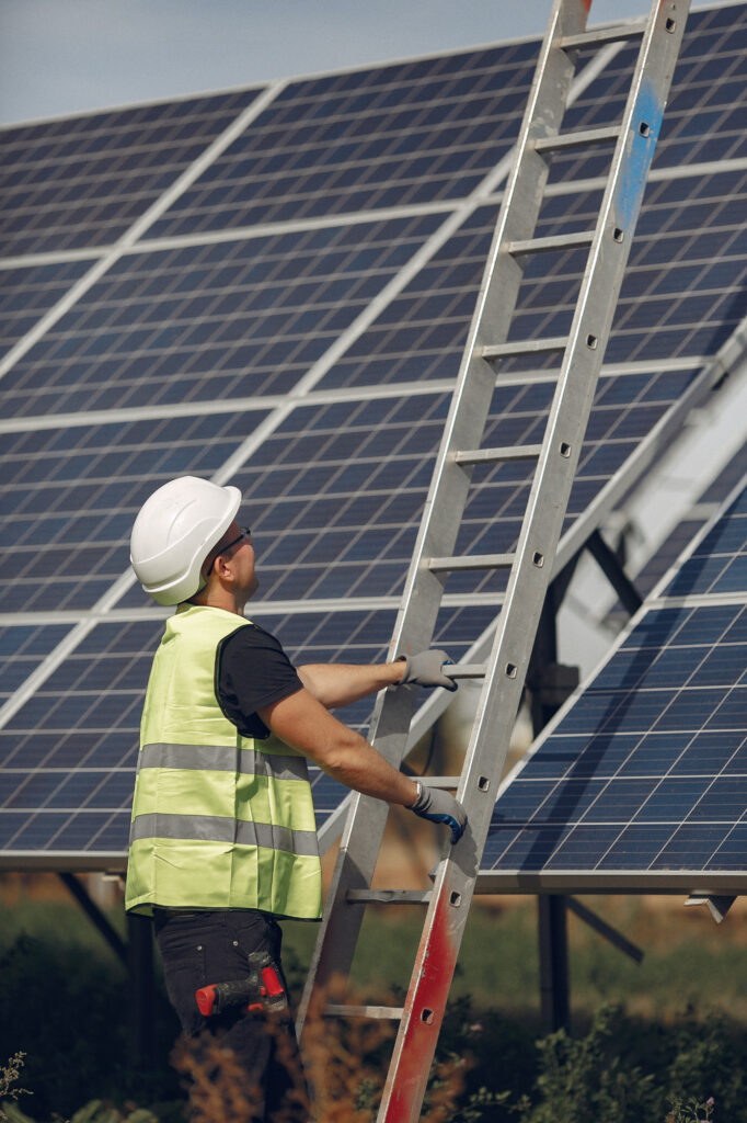 BrightHome Solar technician carefully aligning solar panels on a homeowner’s roof for optimal sunlight capture.