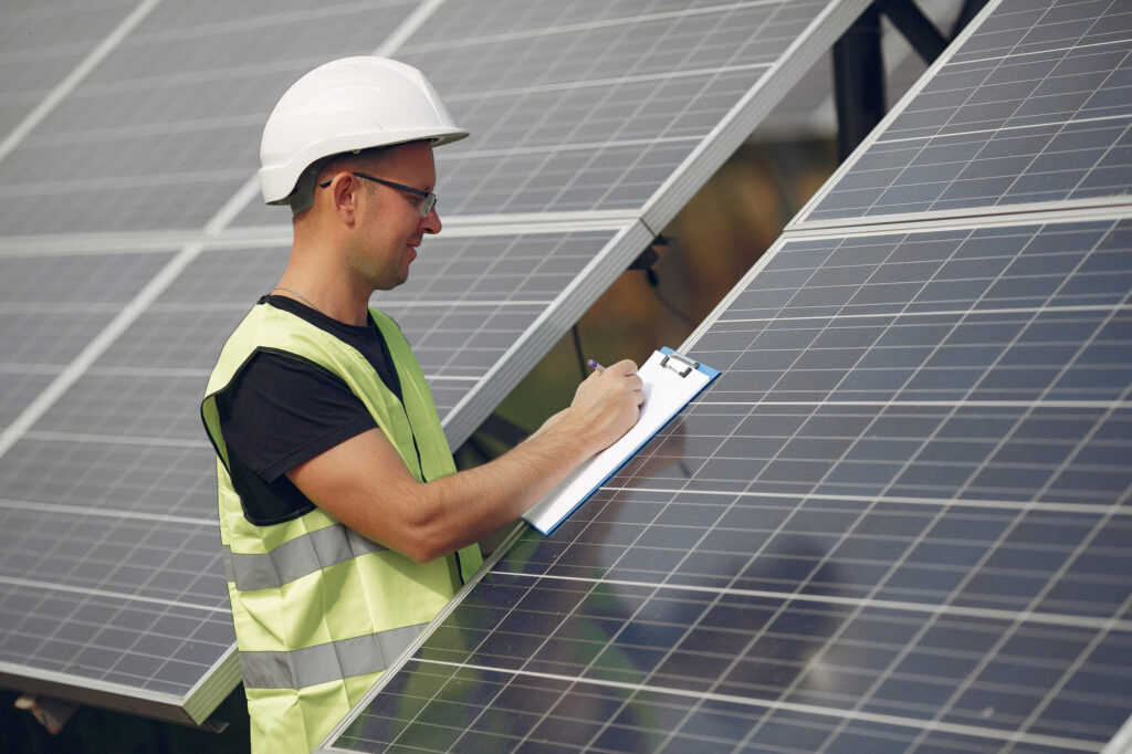 State inspector reviewing a home’s solar installation for approval and Permission to Operate (PTO).